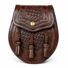 A dark brown leather sporran with intricate hand-tooled basketweave patterns, a snap-buttoned flap, and three braided tassel cords, shown on a clean white background.
